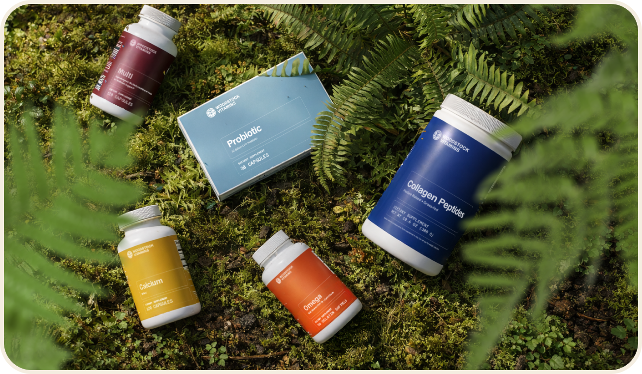 Woodstock Vitamins First5 supplement line photographed on moss with ferns
